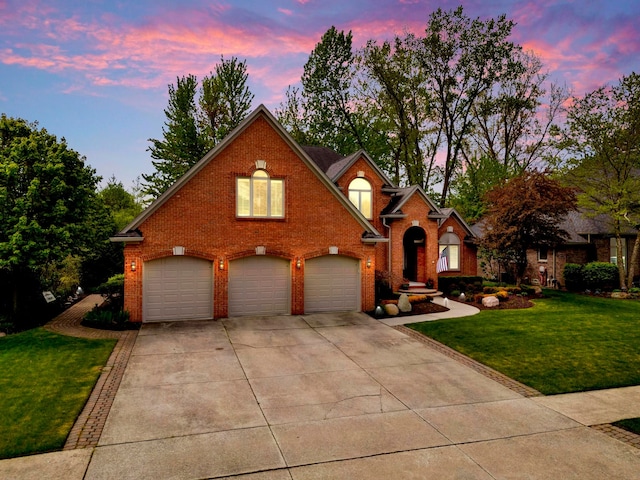 28022 Ashland Ave, Harrison Township, MI 48045 - traditional-style home featuring concrete driveway, a garage, brick siding, and a front yard