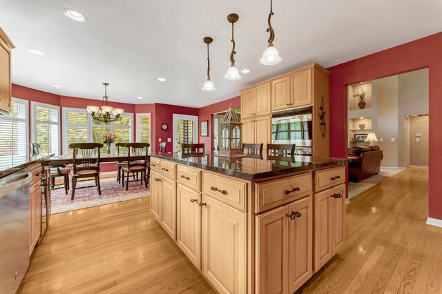 28022 Ashland Ave, Harrison Township, MI 48045 - kitchen featuring light wood-style flooring, light brown cabinets, a chandelier, appliances with stainless steel finishes, and hanging light fixtures