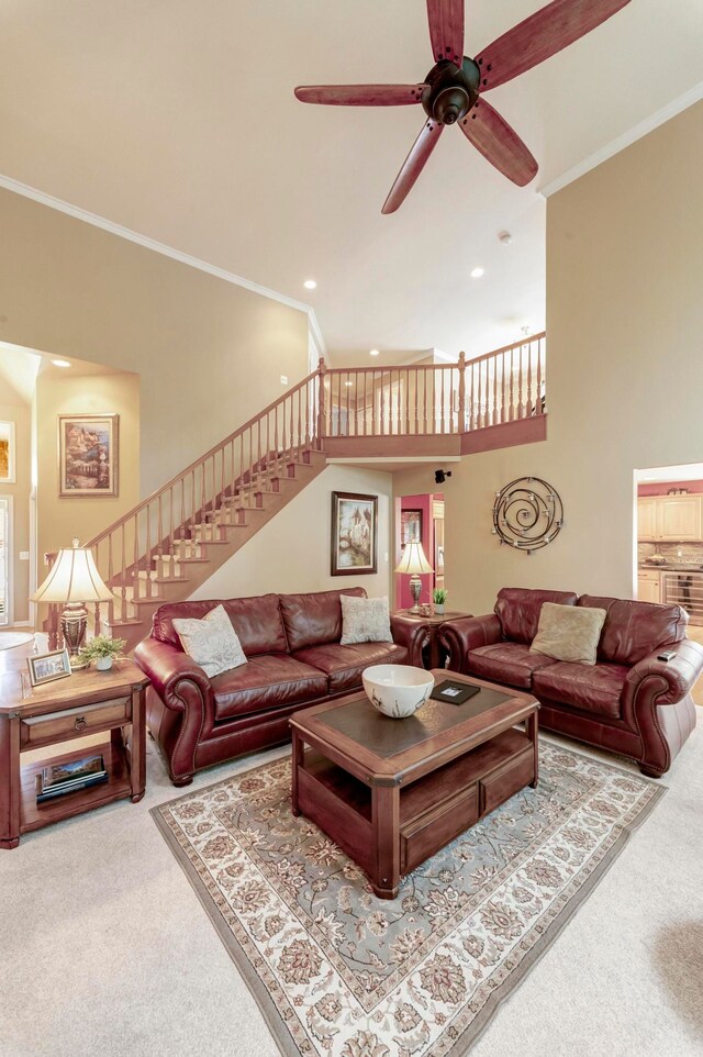 28022 Ashland Ave, Harrison Township, MI 48045 - carpeted living area featuring crown molding, stairs, recessed lighting, ceiling fan, and a towering ceiling