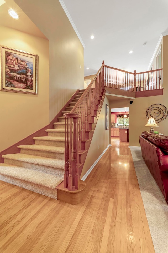 28022 Ashland Ave, Harrison Township, MI 48045 - stairs with wood finished floors, recessed lighting, ornamental molding, and baseboards