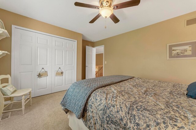 28022 Ashland Ave, Harrison Township, MI 48045 - bedroom featuring light colored carpet, a closet, and a ceiling fan