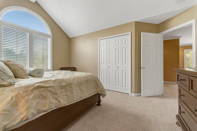 28022 Ashland Ave, Harrison Township, MI 48045 - bedroom featuring light colored carpet, a closet, lofted ceiling, and baseboards