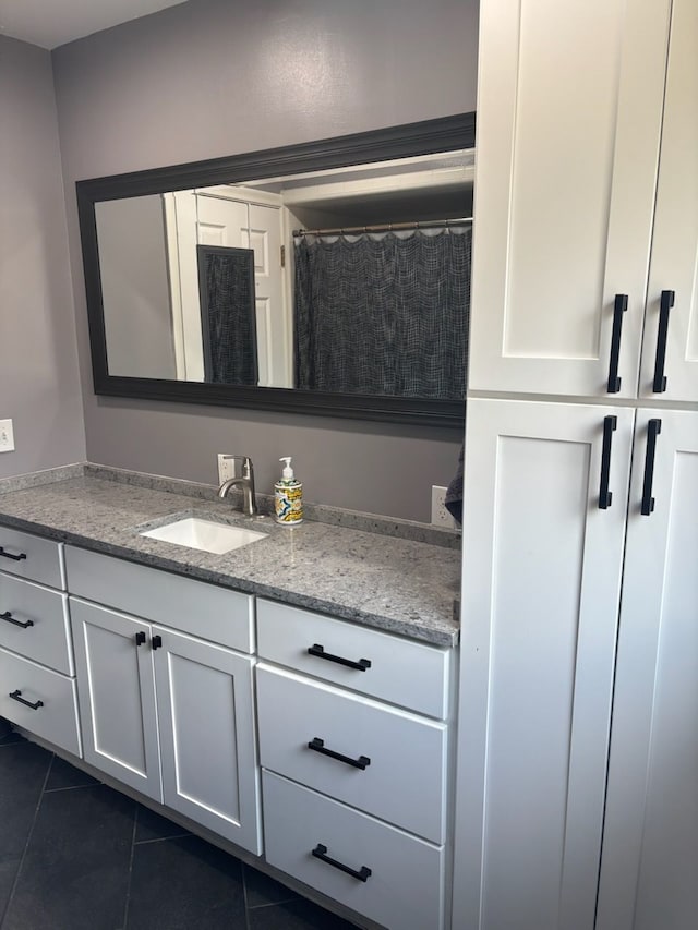 full bathroom with tile patterned flooring and vanity