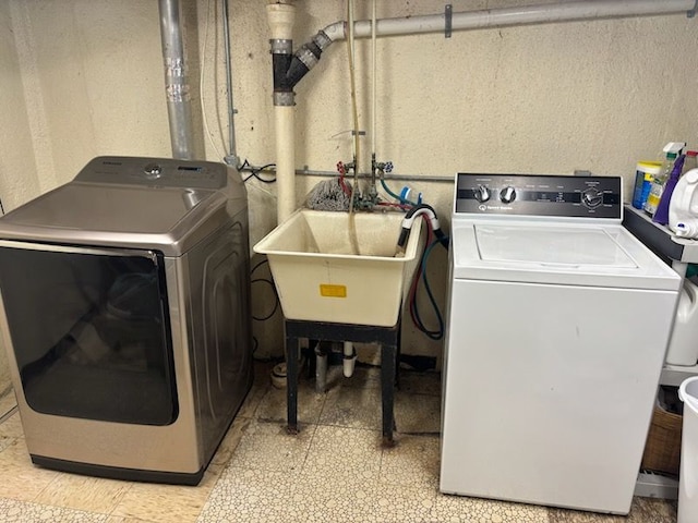 laundry area with washing machine and dryer