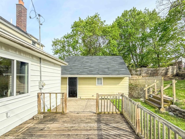 wooden terrace featuring fence
