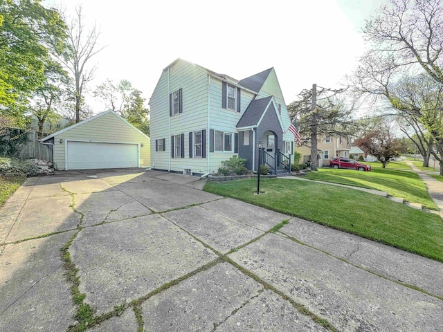 view of front of home with an outdoor structure, a garage, and a front lawn