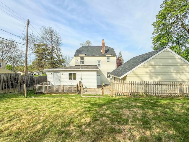 rear view of property featuring a chimney