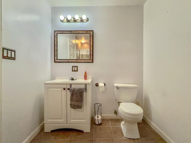 full bath with baseboards, toilet, tile patterned floors, and vanity