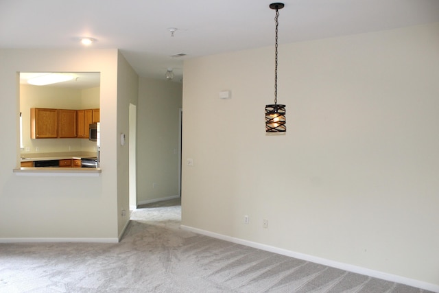 9541 Lakeside Dr, Ypsilanti, MI 48197 - unfurnished dining area featuring light colored carpet and baseboards