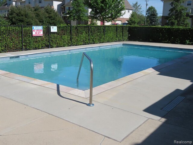 9541 Lakeside Dr, Ypsilanti, MI 48197 - community pool featuring fence