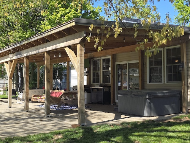 view of patio / terrace featuring a hot tub