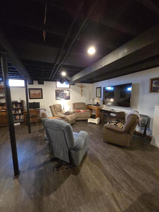 living area with wood finished floors and baseboards