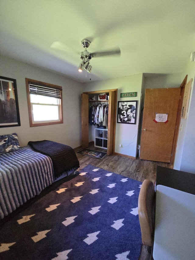 bedroom with wood finished floors, a closet, and ceiling fan