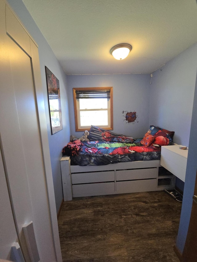 bedroom with wood finished floors