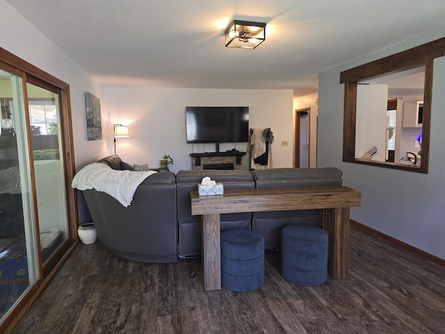 living room featuring dark wood finished floors and baseboards