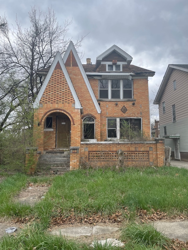 12127 Prairie St, Detroit, MI 48204 - view of front of home with brick siding and a chimney