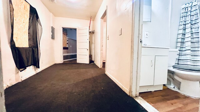 13646 Ryan Rd, Hamtramck, MI 48212 - hallway with baseboards and dark colored carpet