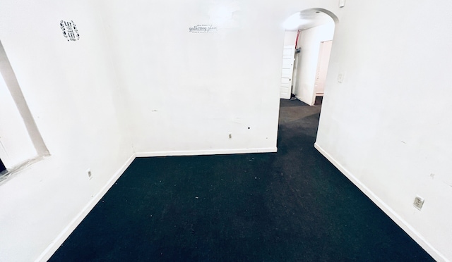 13646 Ryan Rd, Hamtramck, MI 48212 - unfurnished room featuring arched walkways and baseboards