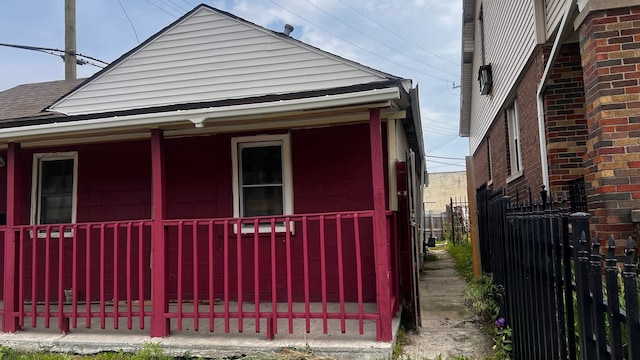 13646 Ryan Rd, Hamtramck, MI 48212 - view of property exterior with fence and covered porch