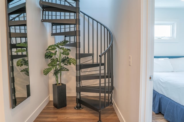 138 Gillis St, Traverse City, MI 49684 - stairs with wood finished floors and baseboards