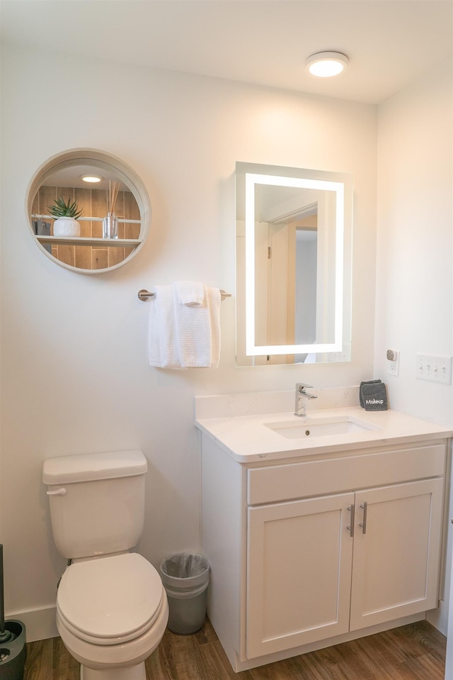 138 Gillis St, Traverse City, MI 49684 - bathroom featuring wood finished floors, toilet, and vanity