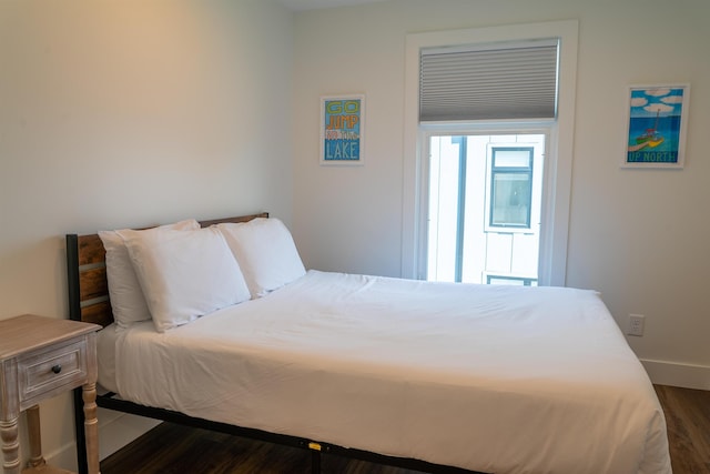 138 Gillis St, Traverse City, MI 49684 - bedroom featuring dark wood-style flooring and baseboards