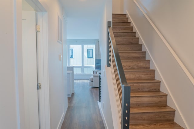 138 Gillis St, Traverse City, MI 49684 - staircase featuring wood finished floors
