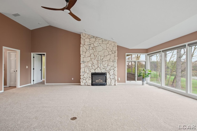 unfurnished living room with high vaulted ceiling, a ceiling fan, plenty of natural light, and carpet