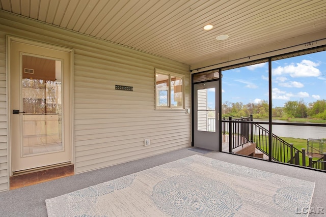sunroom with a water view