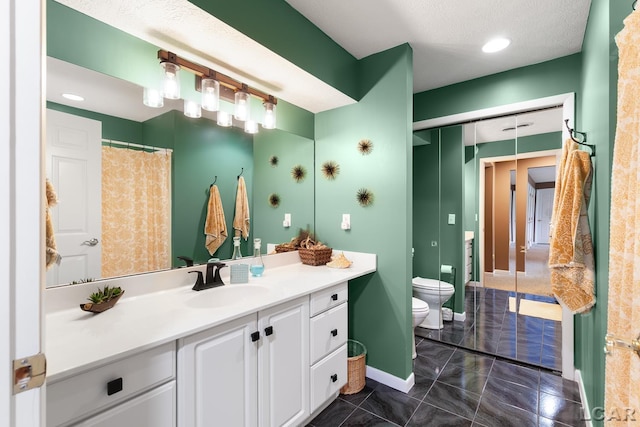 full bath featuring toilet, vanity, baseboards, and recessed lighting