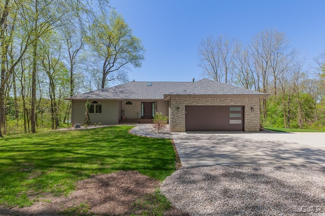 view of front facade featuring concrete driveway, stone siding, a garage, a front lawn, and roof with shingles