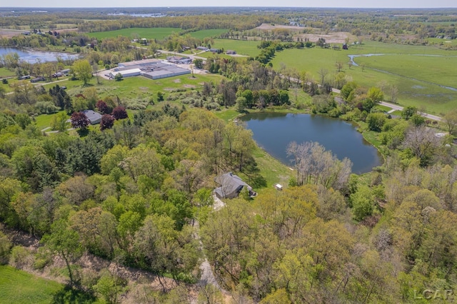 aerial view of property's location with a large body of water and rural landscape