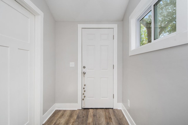 30 Palmer St NW, Grand Rapids, MI 49505 - doorway to outside featuring dark wood-style flooring and baseboards