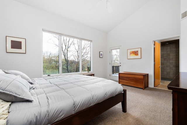 bedroom with carpet and high vaulted ceiling