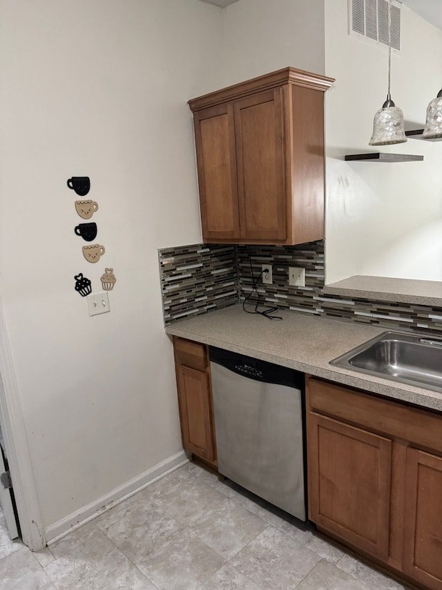 2322 Arcadia Dr, Canton, MI 48188 - kitchen with stainless steel dishwasher, a sink, tasteful backsplash, and brown cabinets