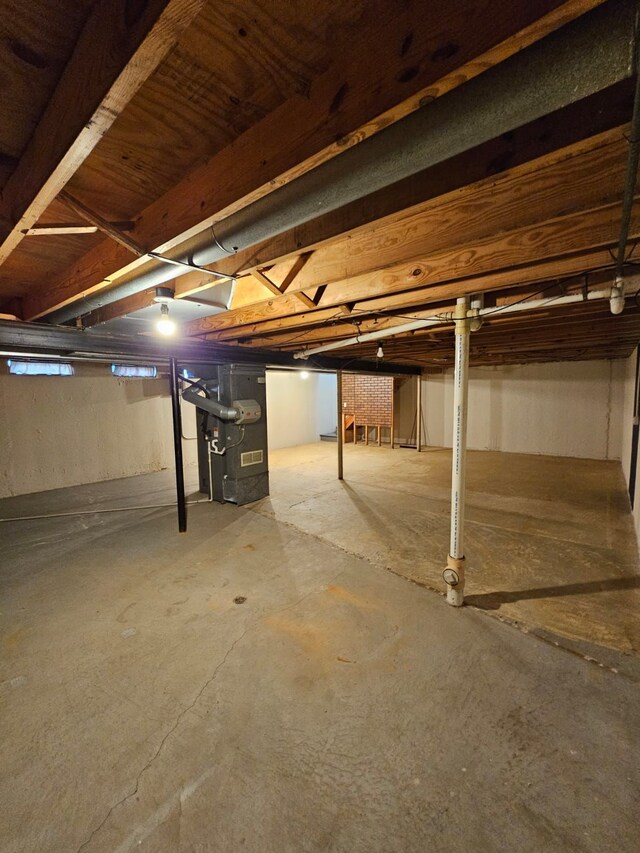 unfinished basement with heating unit