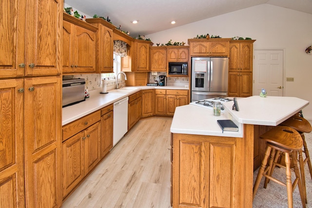 2688 White St, Niles, MI 49120 - kitchen featuring stainless steel fridge with ice dispenser, black microwave, a sink, white dishwasher, and brown cabinetry