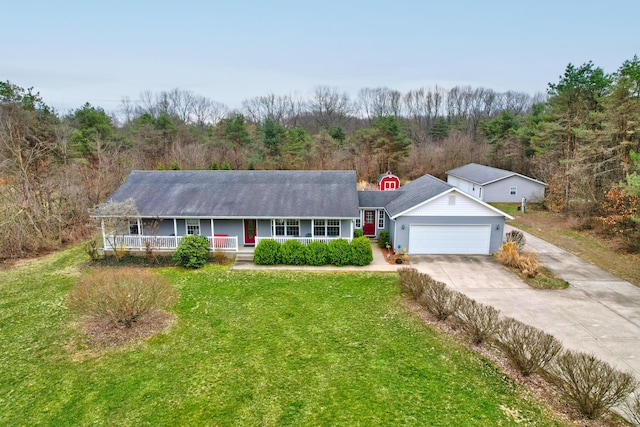 2688 White St, Niles, MI 49120 - single story home featuring a front yard, covered porch, concrete driveway, a garage, and a wooded view