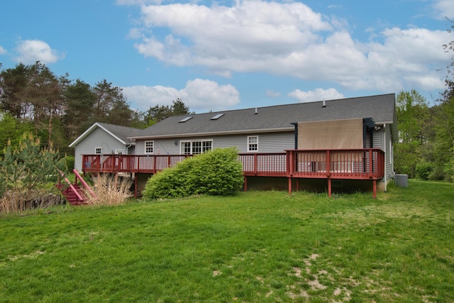 2688 White St, Niles, MI 49120 - back of property with a deck, a lawn, and central AC unit