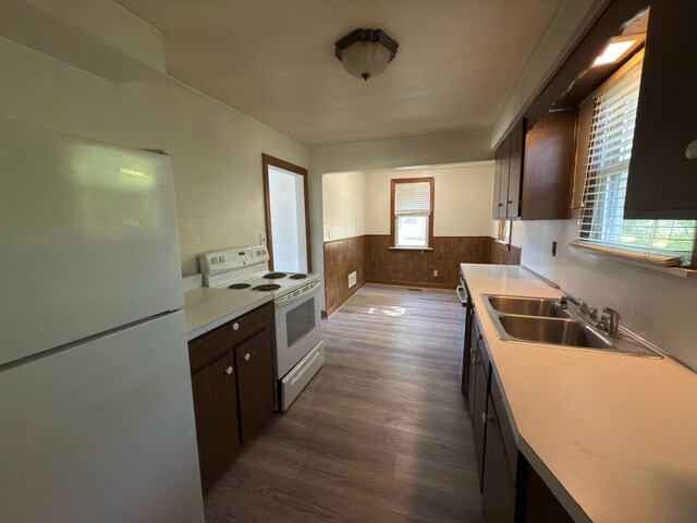 5526 Sylvia St, Dearborn Heights, MI 48125 - kitchen with white appliances, a sink, wainscoting, dark wood-style floors, and dark brown cabinets