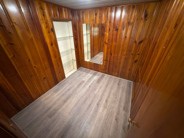 5526 Sylvia St, Dearborn Heights, MI 48125 - spare room featuring wood finished floors and wooden walls