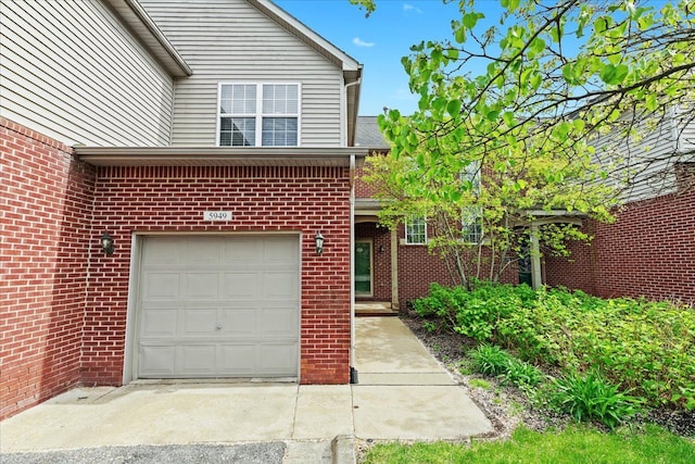 5949 High Point Ct, Brighton, MI 48116 - view of front of property featuring brick siding and an attached garage