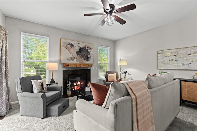 5949 High Point Ct, Brighton, MI 48116 - carpeted living room featuring a glass covered fireplace and ceiling fan