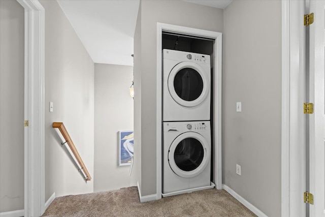 5949 High Point Ct, Brighton, MI 48116 - washroom featuring stacked washer and clothes dryer, carpet, and baseboards