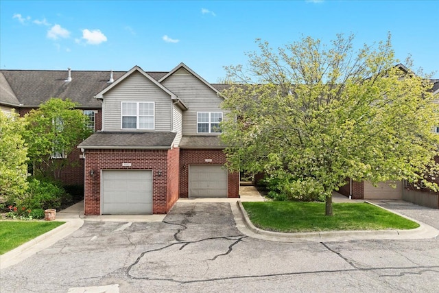 5949 High Point Ct, Brighton, MI 48116 - view of front facade with brick siding, an attached garage, driveway, and roof with shingles