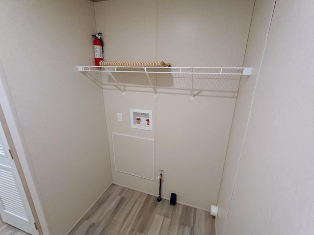 1204 Carlton Ct, Plainwell, MI 49080 - washroom with light wood-type flooring, washer hookup, and baseboards