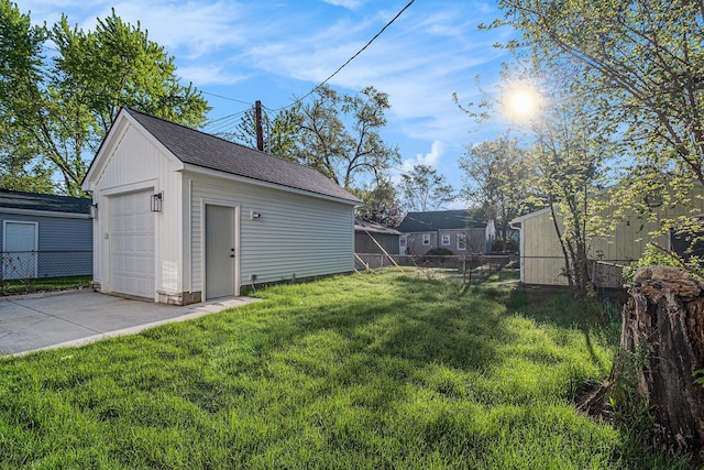 3542 Royal Ave, Berkley, MI 48072 - view of yard featuring a garage, an outbuilding, and driveway