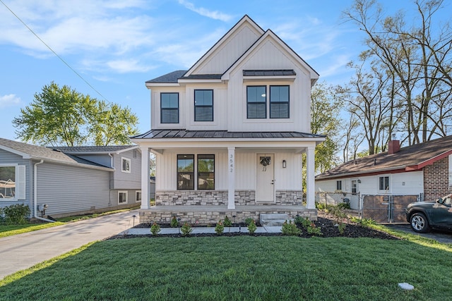 3542 Royal Ave, Berkley, MI 48072 - modern farmhouse style home featuring a standing seam roof, board and batten siding, covered porch, and metal roof