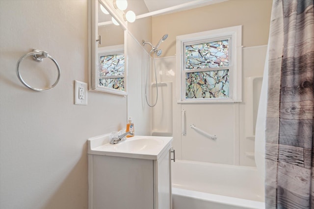 bathroom with shower / bath combo with shower curtain and vanity