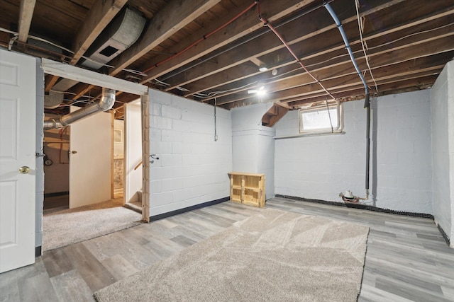 below grade area featuring wood finished floors